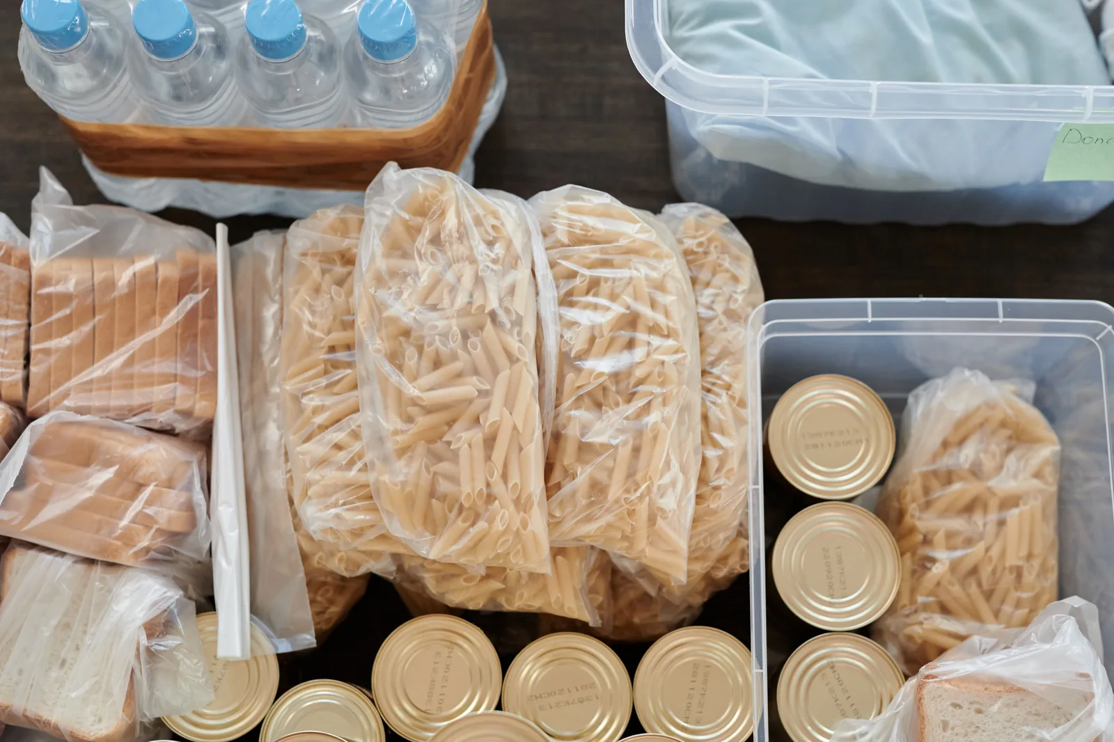 Pantry essentials: water, pasta, canned goods, bread