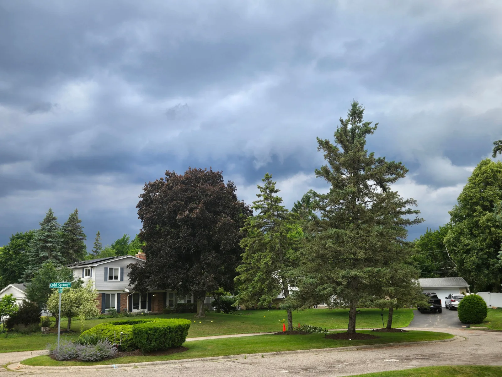 Storm clouds gathering over a suburban American house