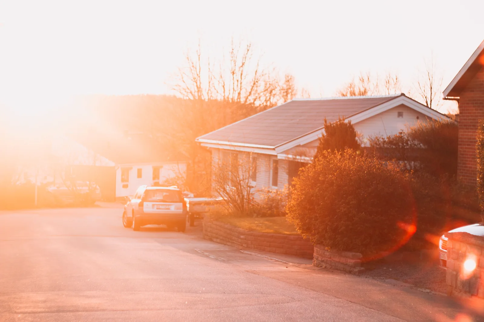 Bright sun over a suburban house during a heat wave